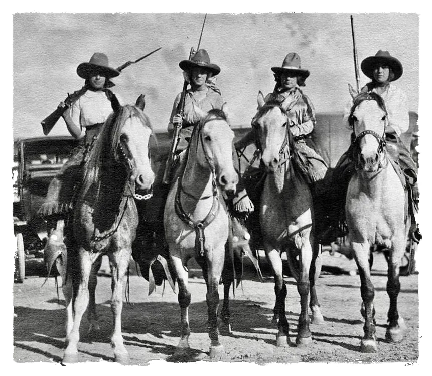 A group of female mail riders for Wells Fargo & Company on horseback, carrying rifles.
